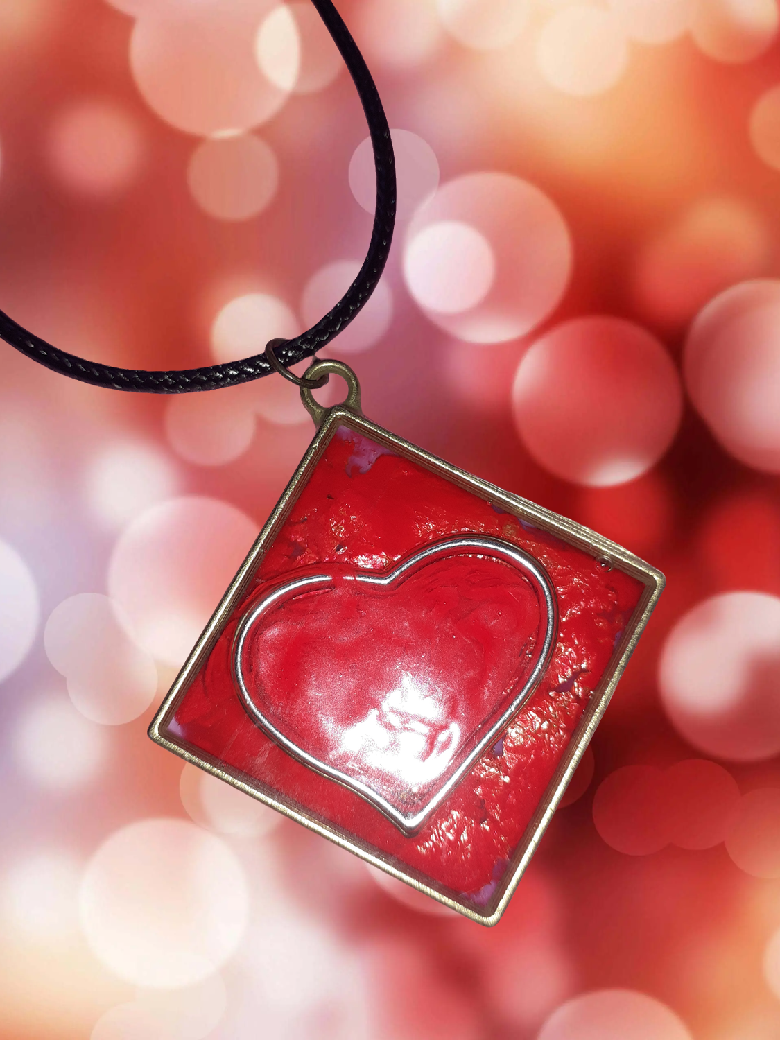 Diamond shaped and within a Silver and Red Heart takes center stage.