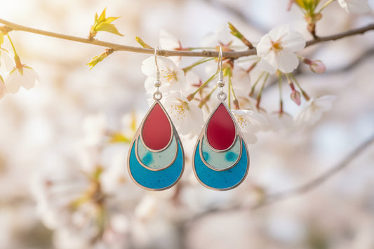 Teardrop-shaped earrings with red, blue, and silver layer