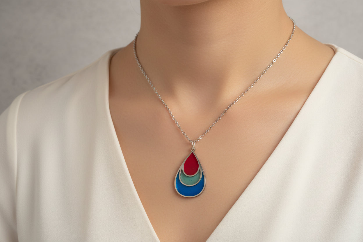 Necklace with a teardrop-shaped pendant .