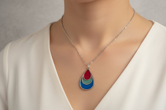Necklace with a teardrop-shaped pendant .